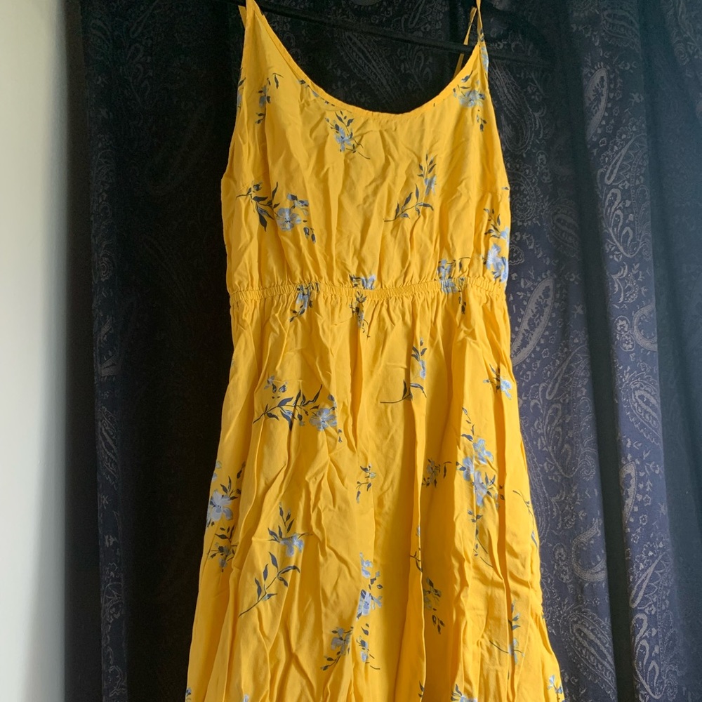 Spaghetti strap dress. The brand is gap. Size: xtra small.  Bright yellow color.
